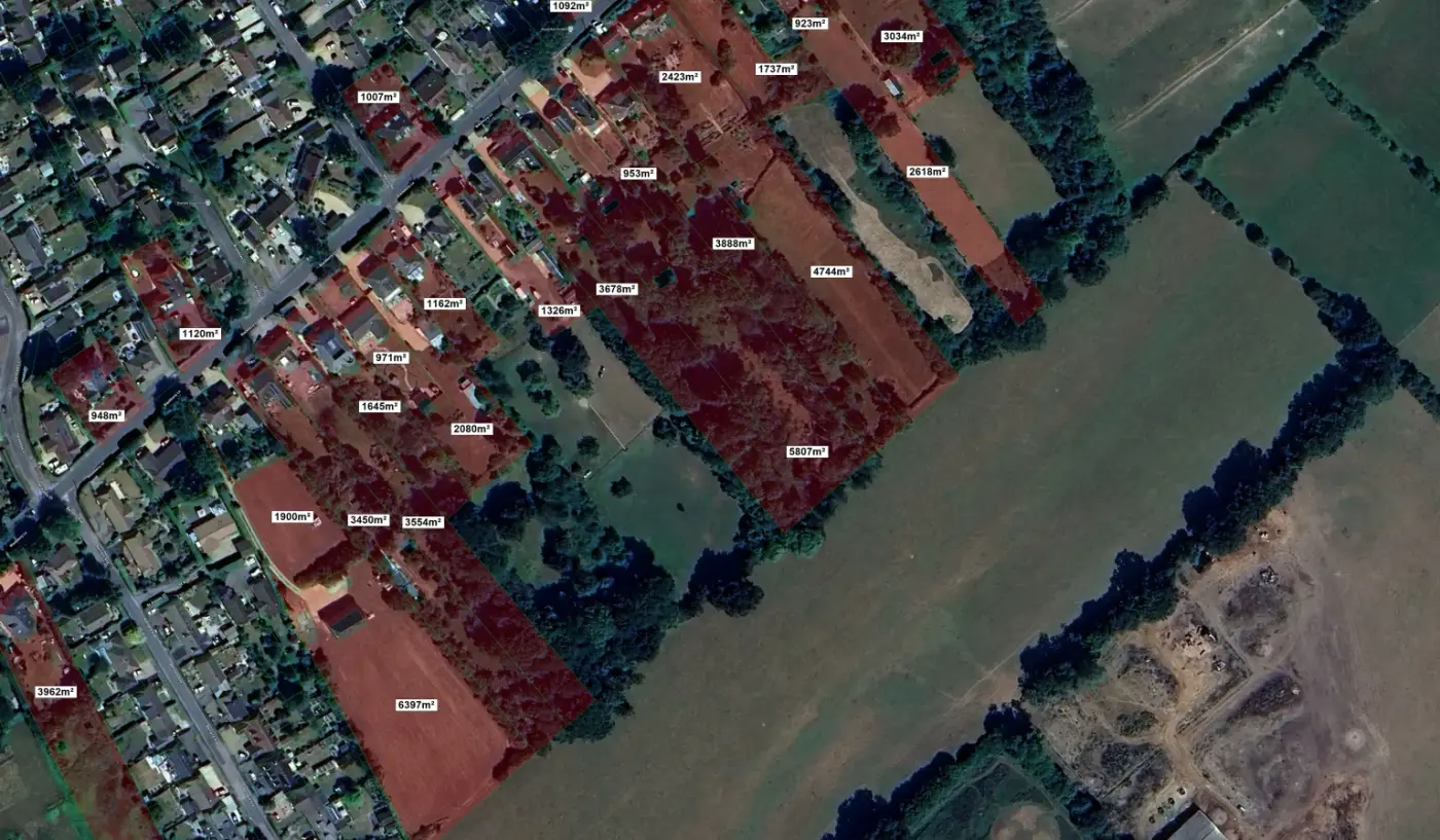 Aerial view of suburban residential properties with labeled land parcels in square meters, showing houses, gardens, tree.